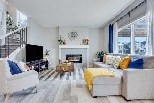 137 Amery Crest, Crossfield, AB - Indoor Photo Showing Living Room With Fireplace