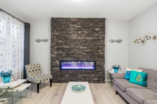43 Seton Rise Se, Calgary, AB - Indoor Photo Showing Living Room With Fireplace