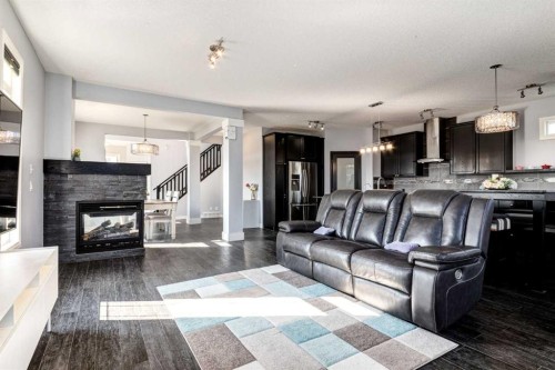 14 Marquis Heights Se, Calgary, AB - Indoor Photo Showing Living Room With Fireplace