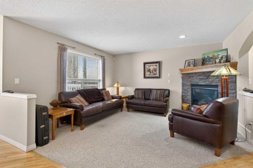 627 Auburn Bay Heights Se, Calgary, AB - Indoor Photo Showing Living Room With Fireplace