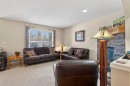 627 Auburn Bay Heights Se, Calgary, AB  - Indoor Photo Showing Living Room With Fireplace 
