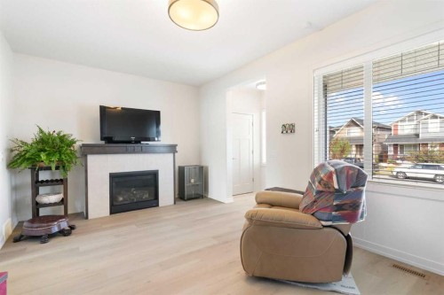167 Fireside Drive, Cochrane, AB - Indoor Photo Showing Living Room With Fireplace