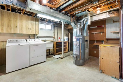 19 Carmangay Crescent Nw, Calgary, AB - Indoor Photo Showing Laundry Room