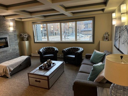 3104-402 Kincora Glen Road Nw, Calgary, AB - Indoor Photo Showing Living Room With Fireplace