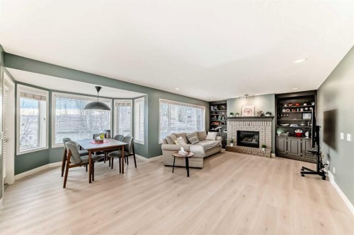 668 Scimitar Bay Nw, Calgary, AB - Indoor Photo Showing Living Room With Fireplace