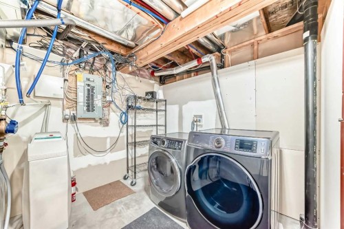 668 Scimitar Bay Nw, Calgary, AB - Indoor Photo Showing Laundry Room