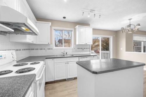 635 Panorama Hills Drive Nw, Calgary, AB - Indoor Photo Showing Kitchen With Double Sink