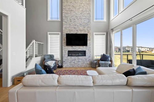 52 Evansfield Manor Nw, Calgary, AB - Indoor Photo Showing Living Room With Fireplace