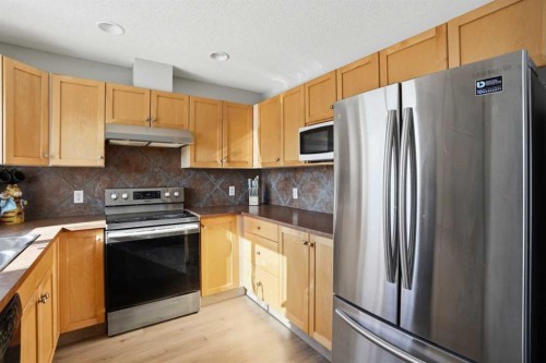 7 Bridleridge Link Sw, Calgary, AB - Indoor Photo Showing Kitchen With Stainless Steel Kitchen