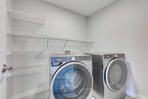 157 Wolf Hollow Drive Se, Calgary, AB - Indoor Photo Showing Laundry Room