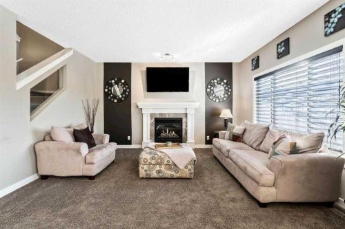 285 Evanspark Gardens Nw, Calgary, AB - Indoor Photo Showing Living Room With Fireplace