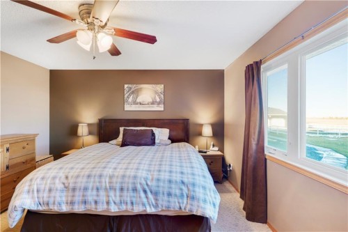 272210 Range Road 291 Ne, Airdrie, AB - Indoor Photo Showing Bedroom