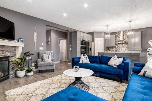 107 Evansbrooke Manor Nw, Calgary, AB - Indoor Photo Showing Living Room With Fireplace