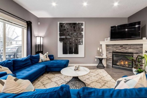 107 Evansbrooke Manor Nw, Calgary, AB - Indoor Photo Showing Living Room With Fireplace