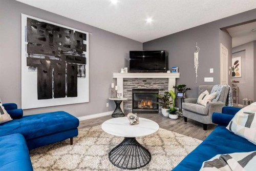 107 Evansbrooke Manor Nw, Calgary, AB - Indoor Photo Showing Living Room With Fireplace