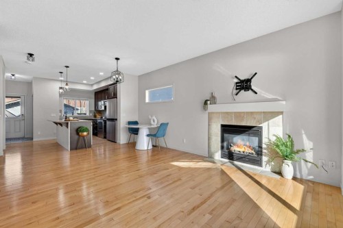 345 Mahogany Boulevard Se, Calgary, AB - Indoor Photo Showing Living Room With Fireplace