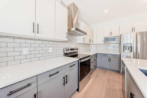 535 Tekarra Drive Nw, Calgary, AB - Indoor Photo Showing Kitchen With Stainless Steel Kitchen With Upgraded Kitchen