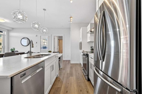 218-30 Walgrove Walk Se, Calgary, AB - Indoor Photo Showing Kitchen With Stainless Steel Kitchen With Double Sink With Upgraded Kitchen