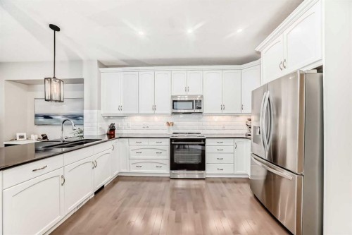 335 Morningside Crescent Sw, Airdrie, AB - Indoor Photo Showing Kitchen With Stainless Steel Kitchen With Upgraded Kitchen