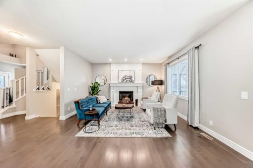 335 Morningside Crescent Sw, Airdrie, AB - Indoor Photo Showing Living Room With Fireplace