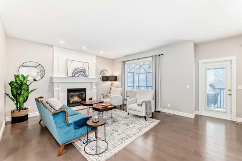 335 Morningside Crescent Sw, Airdrie, AB - Indoor Photo Showing Living Room With Fireplace
