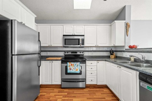 192 Mt Aberdeen Circle Se, Calgary, AB - Indoor Photo Showing Kitchen With Double Sink