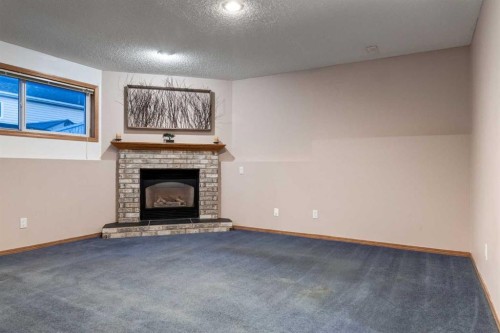 26 Somercrest Circle Sw, Calgary, AB - Indoor With Fireplace