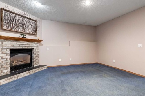 26 Somercrest Circle Sw, Calgary, AB - Indoor With Fireplace