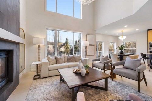 125 Discovery Place Sw, Calgary, AB - Indoor Photo Showing Living Room With Fireplace