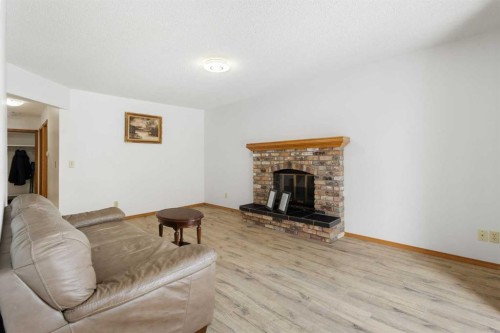 132 Scenic Cove Circle Nw, Calgary, AB - Indoor Photo Showing Living Room With Fireplace