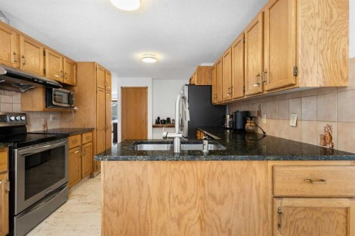 132 Scenic Cove Circle Nw, Calgary, AB - Indoor Photo Showing Kitchen With Double Sink