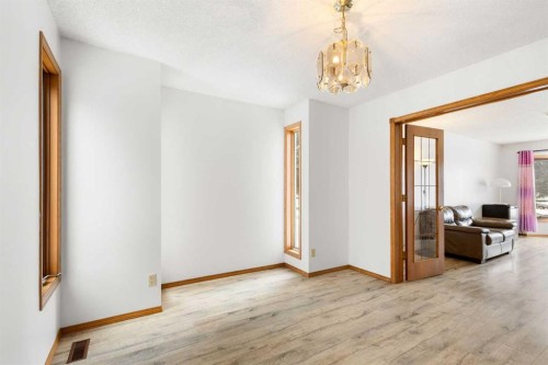 132 Scenic Cove Circle Nw, Calgary, AB - Indoor Photo Showing Other Room With Fireplace