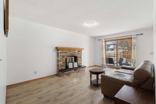 132 Scenic Cove Circle Nw, Calgary, AB - Indoor Photo Showing Living Room With Fireplace