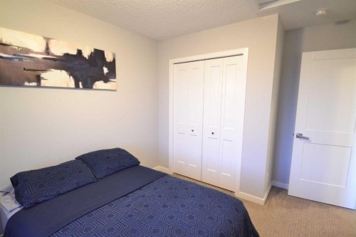 613 Hillcrest Road Sw, Airdrie, AB - Indoor Photo Showing Bedroom