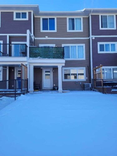 613 Hillcrest Road Sw, Airdrie, AB - Outdoor With Balcony With Facade