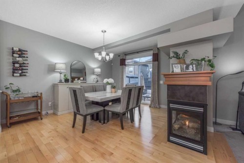 76 Evanspark Circle Nw, Calgary, AB - Indoor Photo Showing Other Room With Fireplace