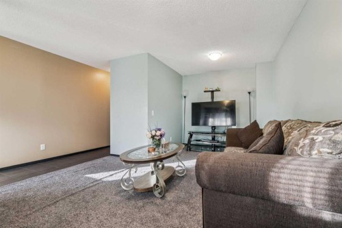 110 Eversyde Common Sw, Calgary, AB - Indoor Photo Showing Living Room