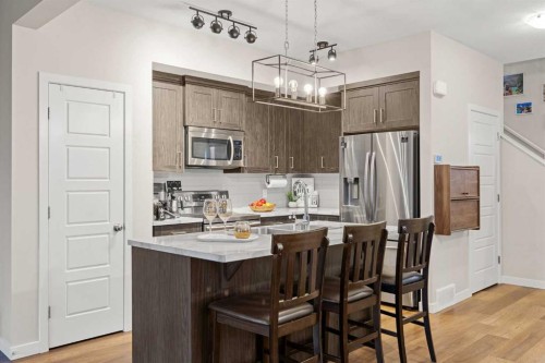 1027 Lanark Boulevard Se, Airdrie, AB - Indoor Photo Showing Kitchen With Stainless Steel Kitchen With Upgraded Kitchen