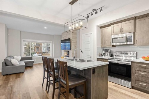 1027 Lanark Boulevard Se, Airdrie, AB - Indoor Photo Showing Kitchen With Double Sink