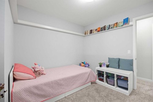 1027 Lanark Boulevard Se, Airdrie, AB - Indoor Photo Showing Bedroom