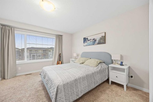 1027 Lanark Boulevard Se, Airdrie, AB - Indoor Photo Showing Bedroom