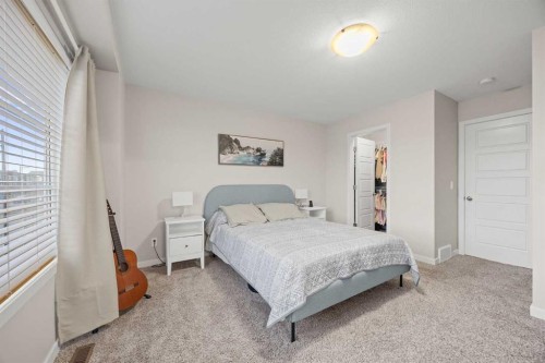 1027 Lanark Boulevard Se, Airdrie, AB - Indoor Photo Showing Bedroom