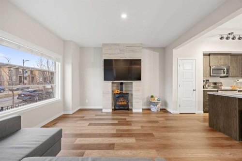 1027 Lanark Boulevard Se, Airdrie, AB - Indoor With Fireplace