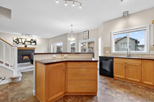 344 Windermere Drive, Chestermere, AB - Indoor Photo Showing Kitchen With Fireplace