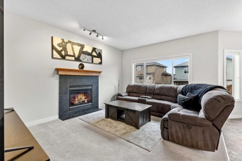 344 Windermere Drive, Chestermere, AB - Indoor Photo Showing Living Room With Fireplace