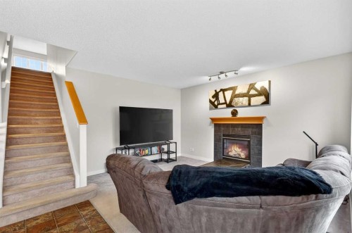 344 Windermere Drive, Chestermere, AB - Indoor Photo Showing Living Room With Fireplace