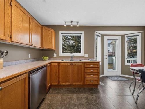 301 Arbour Cliff Close Nw, Calgary, AB - Indoor Photo Showing Kitchen With Double Sink