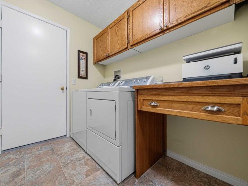 301 Arbour Cliff Close Nw, Calgary, AB - Indoor Photo Showing Laundry Room