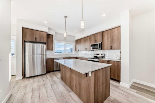 241 Bridgeport Gate, Chestermere, AB - Indoor Photo Showing Kitchen With Upgraded Kitchen