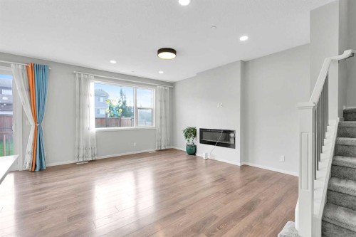 106 Lucas Crescent Nw, Calgary, AB - Indoor Photo Showing Other Room With Fireplace